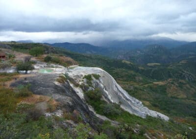 The calcium deposits are caused by thermal springs in which the calcium carbonate precipitates.